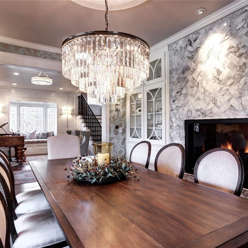 Elegant dining room with chandelier and fireplace